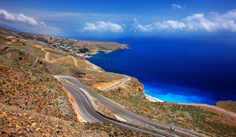 Mountain coastal road in Crete – example of challenging driving conditions